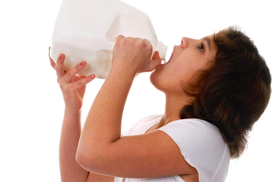 A person guzzling milk