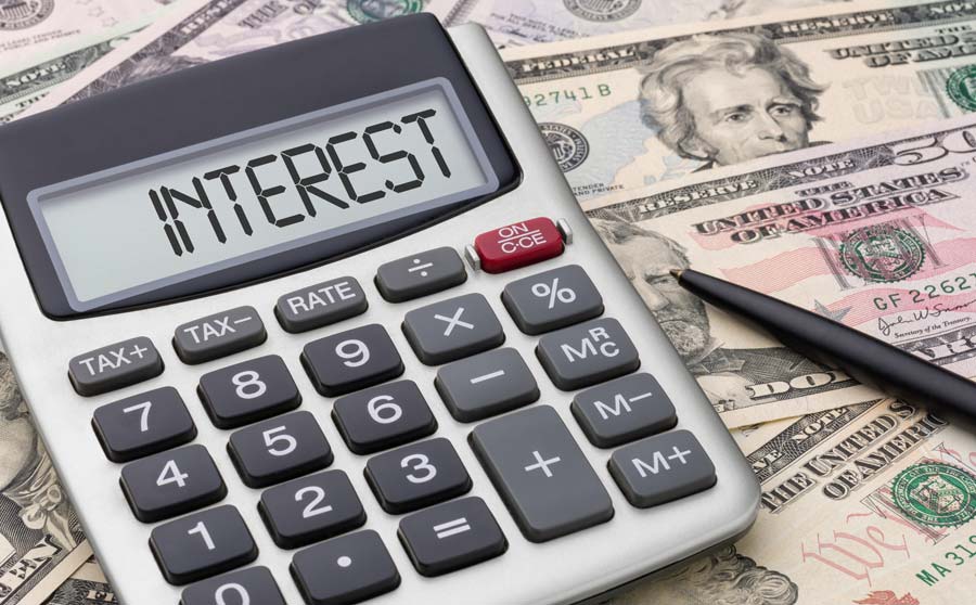 Interest calculator laying on money
